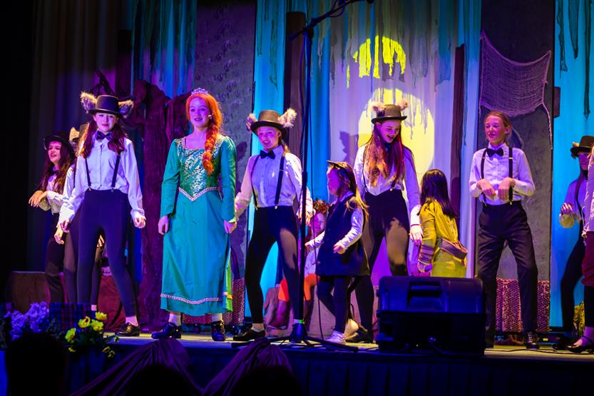 Students perform onstage
